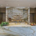 Mary Fitzgerald Instagram - Just Listed - 1375 N. Doheny Dr. - $28,500,000 5 Beds / 9 Baths / 10,613 Sq. Ft. / 17,438 Lot Size Recently gracing the prestigious cover of Architectural Digest, this estate stands as an embodiment of timeless sophistication, meticulously curated from materials all over the world to create one of the most special homes in all of Los Angeles. Discreetly concealed beyond a privately gated driveway, an oversized motor court is laid with 200+ year-old reclaimed cobblestone from the historic streets of Boston. Experience the epitome of refined living with an open floor plan, double-height ceilings, and palatial steel-framed Crittal sliding glass doors which seamlessly unite the interior/outdoor spaces including a serene pool, covered patio, and verdant lawn. The sensuous chef’s kitchen is an epicurean haven boasting custom bronze-patinated cabinets, top-of-the-line appliances including floating burners by Pitt, and 20 slabs of book-matched Calacatta marble bearing an Rorschach-like allure. The owner’s suite bath, inspired by Jean Michel Frank - a French art deco architect known for his soft, undulating lines - stands as the quintessence of unparalleled elegance and decadence; every square inch has been cocooned in 40 slabs of Calacatta Breccia Capraia, (an impossibly rare marble from Italy that was used throughout Italian churches for hundreds of years) including the steam shower’s built-in chaise lounge to the monolithic tub hewn from a single block of stone, all paired with opulent Waterworks fixtures. Bespoke amenities include an office wrapped in an envelope of reclaimed French Oak, a state-of-the-art theater, wine cellar, gym, recreation room, private library, unrivaled security, and audio/visual integration. Unquestionably the most impressively crafted and composed property available, tailored for the most discerning buyer desiring perfection. Listed by @themarybonnet @jasonoppenheim