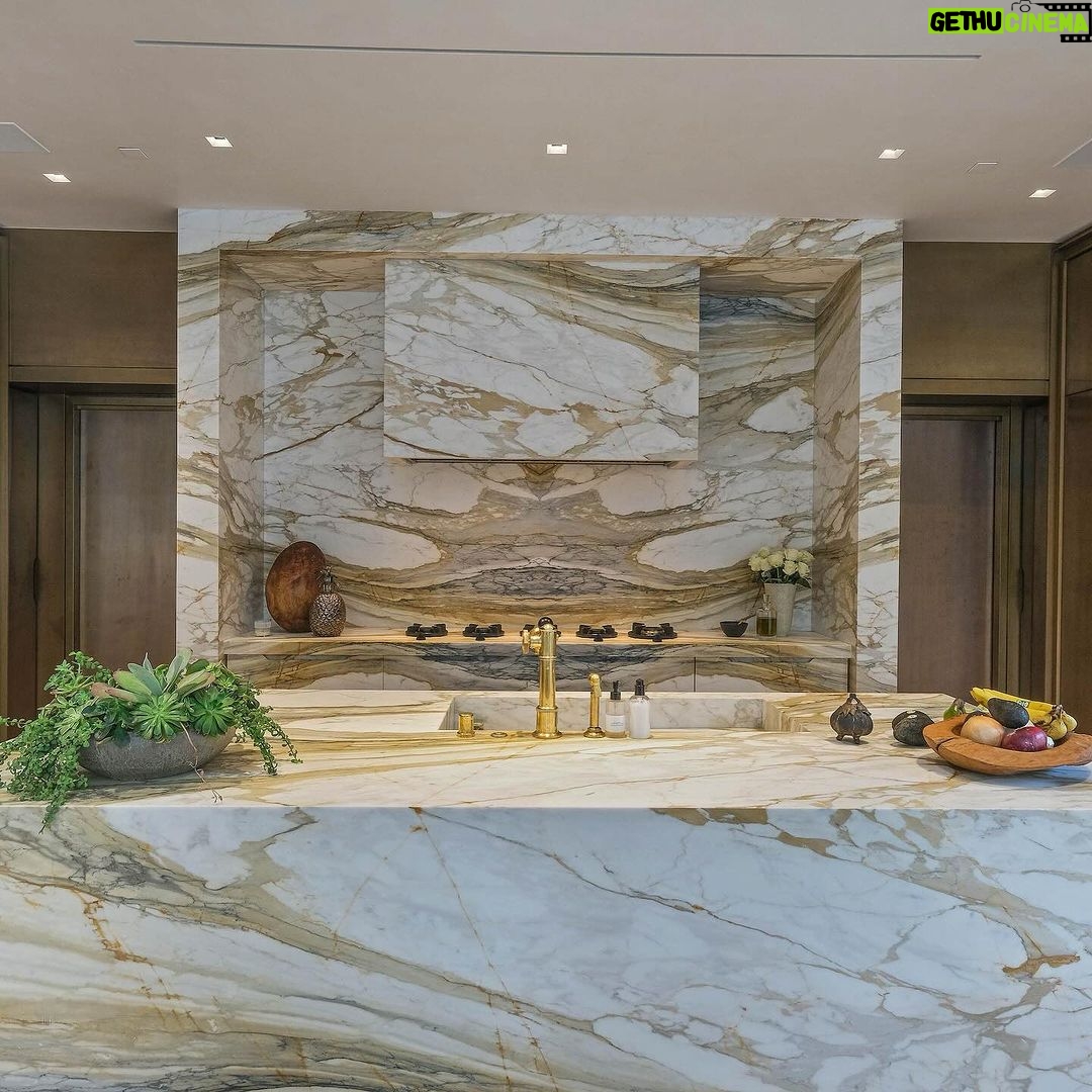 Mary Fitzgerald Instagram - Just Listed - 1375 N. Doheny Dr. - $28,500,000 5 Beds / 9 Baths / 10,613 Sq. Ft. / 17,438 Lot Size Recently gracing the prestigious cover of Architectural Digest, this estate stands as an embodiment of timeless sophistication, meticulously curated from materials all over the world to create one of the most special homes in all of Los Angeles. Discreetly concealed beyond a privately gated driveway, an oversized motor court is laid with 200+ year-old reclaimed cobblestone from the historic streets of Boston. Experience the epitome of refined living with an open floor plan, double-height ceilings, and palatial steel-framed Crittal sliding glass doors which seamlessly unite the interior/outdoor spaces including a serene pool, covered patio, and verdant lawn. The sensuous chef’s kitchen is an epicurean haven boasting custom bronze-patinated cabinets, top-of-the-line appliances including floating burners by Pitt, and 20 slabs of book-matched Calacatta marble bearing an Rorschach-like allure. The owner’s suite bath, inspired by Jean Michel Frank - a French art deco architect known for his soft, undulating lines - stands as the quintessence of unparalleled elegance and decadence; every square inch has been cocooned in 40 slabs of Calacatta Breccia Capraia, (an impossibly rare marble from Italy that was used throughout Italian churches for hundreds of years) including the steam shower’s built-in chaise lounge to the monolithic tub hewn from a single block of stone, all paired with opulent Waterworks fixtures. Bespoke amenities include an office wrapped in an envelope of reclaimed French Oak, a state-of-the-art theater, wine cellar, gym, recreation room, private library, unrivaled security, and audio/visual integration. Unquestionably the most impressively crafted and composed property available, tailored for the most discerning buyer desiring perfection. Listed by @themarybonnet @jasonoppenheim