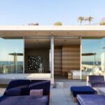 Mary Fitzgerald Instagram - 🏠 🌊 Coming Soon in Malibu - 24844 Malibu Rd. - $53,000,000 An architectural tour de force and only one of the few private homes in the United States designed by the renowned Pritzker Prize-winning Japanese architect, Tadao Ando. Best known for his minimalist structures and his assured use of reinforced concrete, Ando’s trademark design of “smooth-as-silk” concrete is wholly present in the structure and surface of the home. Constructed of approximately 1,200 tons of concrete, 200 tons of steel reinforcement, and 12 massive pylons driven more than 60 feet into the sand with AD100 architecture firm Marmol Radziner acting as executive architect and general contractor, the structure is an everlasting beacon of permanence on California’s coastline. Natural light is used creatively throughout the space, another signature of Ando, to manipulate a warm feeling throughout the building and harmonize with its natural surroundings. The home spans +/- 4,000 sq. ft. of interior space and approximately 1,500 sq. ft. of outdoor decks with ocean views from every room. Currently all interior finishes have been removed from the property, and work is needed to either restore or reimagine the interiors. Thoughtfully located on the prestigious and quiet Malibu Road, with easy access and close proximity to the finest restaurants, shopping, and entertainment in all of Malibu. An exceedingly rare architectural achievement that should be seen as a masterful work of art, rather than just a residence. Listing Agent: @jasonoppenheim @theoppenheimgroup