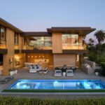Mary Fitzgerald Instagram - Just Listed in Manhattan Beach - 1001 1st St. - $29,900,000 6 Bed / 9 Bath / 9,479 Sq. Ft. The most impressive and high-quality Contemporary estate ever built in Manhattan Beach, featuring panoramic ocean views from every room. After a laborious multi-year build, this approximately 9,500 sq. ft. showstopper seamlessly fuses glass, cedar, and concrete into a triumphant architectural tour de force with a sense of permanence and grandeur. Integral to the structure and aesthetic of the home, the scalloped concrete walls seen on the exterior and interior walls resemble an undulating wave-like texture accomplished by custom milled formwork which complement the surrounding Pacific landscape. Custom cedar clads the remaining walls and ceilings, bringing warmth and visual impact throughout the sleek space. Double-height ceilings and oversized automated Otiima pocketing doors and windows create a sense of expansion within, as the home seamlessly unfolds into an extensive beautifully landscaped outdoor terrace and pool/spa perfect for California living. An additional shaded patio with fireplace is created by the deep cedar overhangs from the upper floor and the roof. Generously nestled on an extra-wide corner lot, the home is replete with 6 bedrooms plus an additional office/nursery, 9 bathrooms, home theater, game room, wine cellar, wet bar, and gym, with architecture by Laney LA. Additional amenities include 48 solar panels with Tesla Powerwalls, elevator, 14 zone A/C technology platform system, Control4 home automation, and 3-car garage with additional driveway parking. An exceptionally rare opportunity to own a meticulously crafted beach estate with soul and sophistication.