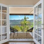 Mary Fitzgerald Instagram - JUST LISTED IN BRENTWOOD A TIMELESS, REMODELED RESIDENCE WITH PANORAMIC CANYON VIEWS AND SECURITY PATROL😊 🏠2305 CANYONBACK RD. - $3,490,000 Nestled amidst a beautiful canyon landscape, this contemporary residence spans an impressive 4.488 square feet and exudes timeless elegance Offering community 24-hour security patrol, this home ensures both serenity and safety in equal measure. The remodeled interior embraces a warm traditional aesthetic, creating an inviting atmosphere throughout. The grandeur of the living room is accentuated by its soaring 12-foot ceilings and expansive scale, providing an ideal backdrop for showcasing artwork. A gourmet chef's kitchen awaits adorned with top-of-the-line Wolf appliances. Entertaining quests is a joy in the generously-sized dining room, with separate breaktast area also ottering a more casual setting for daily meals Ascend the gracious circular stairwell to discover the primary suite, where panoramic vistas embrace the tranquil ambiance. Indulge in the spa-like bath replete with enormous slabs of white marble, and revel in the abundance of space within the walk-in closet. The upper level continues to impress with two additional en-suite bedrooms, each boasting high ceilings, beautitully updated bathrooms, and private balconies. Escape to the private and peaceful backyard with a built-in BBQ and grassy yard. Private attached 2-car garage. Communitv amenities include pool, tennis courts, and security patrol. 🛌 BEDS: 4 📏 SO. FT.: 4.488 💰 $3.490.000 🛁 BATHS: 4 🚘 PARKING: 2 CAR Listing Agents: @kanelk_k @jasonoppenheim