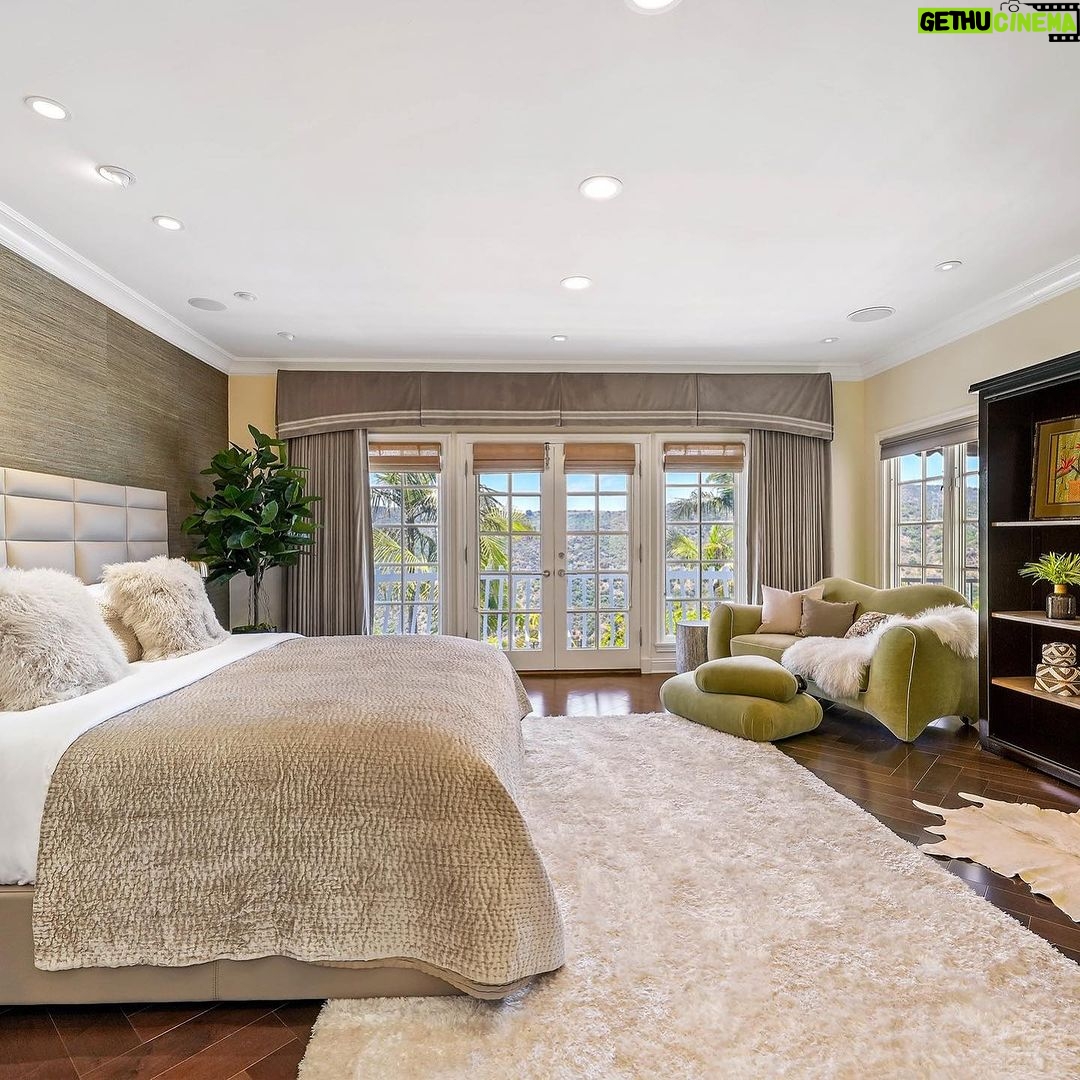 Mary Fitzgerald Instagram - JUST LISTED IN BRENTWOOD A TIMELESS, REMODELED RESIDENCE WITH PANORAMIC CANYON VIEWS AND SECURITY PATROLπ π 2305 CANYONBACK RD. - $3,490,000 Nestled amidst a beautiful canyon landscape, this contemporary residence spans an impressive 4.488 square feet and exudes timeless elegance Offering community 24-hour security patrol, this home ensures both serenity and safety in equal measure. The remodeled interior embraces a warm traditional aesthetic, creating an inviting atmosphere throughout. The grandeur of the living room is accentuated by its soaring 12-foot ceilings and expansive scale, providing an ideal backdrop for showcasing artwork. A gourmet chef's kitchen awaits adorned with top-of-the-line Wolf appliances. Entertaining quests is a joy in the generously-sized dining room, with separate breaktast area also ottering a more casual setting for daily meals Ascend the gracious circular stairwell to discover the primary suite, where panoramic vistas embrace the tranquil ambiance. Indulge in the spa-like bath replete with enormous slabs of white marble, and revel in the abundance of space within the walk-in closet. The upper level continues to impress with two additional en-suite bedrooms, each boasting high ceilings, beautitully updated bathrooms, and private balconies. Escape to the private and peaceful backyard with a built-in BBQ and grassy yard. Private attached 2-car garage. Communitv amenities include pool, tennis courts, and security patrol. π BEDS: 4 π SO. FT.: 4.488 π° $3.490.000 π BATHS: 4 π PARKING: 2 CAR Listing Agents: @kanelk_k @jasonoppenheim