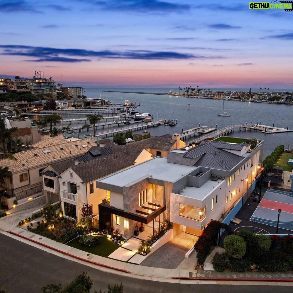Mary Fitzgerald Instagram - Just Listed - 2201 Bayside Dr. - $27,995,000 5 Beds / 9 Baths / 9,129 Sq. Ft. / 11,921 Lot Size This newly constructed custom estate offers exclusive Corona Del Mar waterfront living with intricate design touches and a harmonious blend of natural stone and wood elements. Consisting of 5 ensuite bedrooms and 9 bathrooms and boasting approximately 50 feet of private beachfront, it caters to water enthusiasts and offers shared ownership of one of the longest private docks on the west coast, capable of accommodating multiple yachts up to 100ft in length. Upon arrival, you will be greeted by meticulously landscaped surroundings, a striking grand pivot door, and a double height foyer that sets the tone for the residence. Inside, the space boasts European wide plank bleached oak flooring by Gaetano, illuminated floating staircases, and expansive glass features that fill the approximately 9,129 square feet of interiors with an abundance of natural light. The property seamlessly connects to its surroundings through slide-away pocket doors that open onto a heated patio, a zero-edge saltwater pool and spa, and a courtyard featuring a built-in Lynx Grill. The kitchen features custom Honed Calcatta Vagli slab countertops and backsplash, a 55" La Canche designer stove imported from Paris, a butler's pantry, and stained white oak cabinetry. Convenience is paramount, with a Waupaca elevator servicing all four floors, including the lower level, which encompasses a media area, a dry bar, and temperature controlled wine room. Upstairs, the owner's suite presents a heated wraparound balcony with mesmerizing water views, a living space with a fireplace, and two spa-like bathrooms, each complemented by its own walk-in closet. The top level reveals a lounge area that opens onto a rooftop deck with grass and sweeping views of the Newport Beach Harbor offering limitless ocean-view entertaining. Equipped with cutting-edge technology, the property also includes a nearly 3,000 sq. ft., 6+ car garage with epoxy flooring. Listed by @briancharlesfurstenfeld @mskaylacardona @jasonoppenheim #theoppenheimgroup #realestate #luxurylifestyle #fyp #newlisting