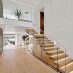 Mary Fitzgerald Instagram - Just Listed - 2201 Bayside Dr. - $27,995,000 5 Beds / 9 Baths / 9,129 Sq. Ft. / 11,921 Lot Size This newly constructed custom estate offers exclusive Corona Del Mar waterfront living with intricate design touches and a harmonious blend of natural stone and wood elements. Consisting of 5 ensuite bedrooms and 9 bathrooms and boasting approximately 50 feet of private beachfront, it caters to water enthusiasts and offers shared ownership of one of the longest private docks on the west coast, capable of accommodating multiple yachts up to 100ft in length. Upon arrival, you will be greeted by meticulously landscaped surroundings, a striking grand pivot door, and a double height foyer that sets the tone for the residence. Inside, the space boasts European wide plank bleached oak flooring by Gaetano, illuminated floating staircases, and expansive glass features that fill the approximately 9,129 square feet of interiors with an abundance of natural light. The property seamlessly connects to its surroundings through slide-away pocket doors that open onto a heated patio, a zero-edge saltwater pool and spa, and a courtyard featuring a built-in Lynx Grill. The kitchen features custom Honed Calcatta Vagli slab countertops and backsplash, a 55" La Canche designer stove imported from Paris, a butler's pantry, and stained white oak cabinetry. Convenience is paramount, with a Waupaca elevator servicing all four floors, including the lower level, which encompasses a media area, a dry bar, and temperature controlled wine room. Upstairs, the owner's suite presents a heated wraparound balcony with mesmerizing water views, a living space with a fireplace, and two spa-like bathrooms, each complemented by its own walk-in closet. The top level reveals a lounge area that opens onto a rooftop deck with grass and sweeping views of the Newport Beach Harbor offering limitless ocean-view entertaining. Equipped with cutting-edge technology, the property also includes a nearly 3,000 sq. ft., 6+ car garage with epoxy flooring. Listed by @briancharlesfurstenfeld @mskaylacardona @jasonoppenheim #theoppenheimgroup #realestate #luxurylifestyle #fyp #newlisting