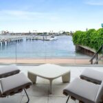 Mary Fitzgerald Instagram - Just Listed - 2201 Bayside Dr. - $27,995,000 5 Beds / 9 Baths / 9,129 Sq. Ft. / 11,921 Lot Size This newly constructed custom estate offers exclusive Corona Del Mar waterfront living with intricate design touches and a harmonious blend of natural stone and wood elements. Consisting of 5 ensuite bedrooms and 9 bathrooms and boasting approximately 50 feet of private beachfront, it caters to water enthusiasts and offers shared ownership of one of the longest private docks on the west coast, capable of accommodating multiple yachts up to 100ft in length. Upon arrival, you will be greeted by meticulously landscaped surroundings, a striking grand pivot door, and a double height foyer that sets the tone for the residence. Inside, the space boasts European wide plank bleached oak flooring by Gaetano, illuminated floating staircases, and expansive glass features that fill the approximately 9,129 square feet of interiors with an abundance of natural light. The property seamlessly connects to its surroundings through slide-away pocket doors that open onto a heated patio, a zero-edge saltwater pool and spa, and a courtyard featuring a built-in Lynx Grill. The kitchen features custom Honed Calcatta Vagli slab countertops and backsplash, a 55" La Canche designer stove imported from Paris, a butler's pantry, and stained white oak cabinetry. Convenience is paramount, with a Waupaca elevator servicing all four floors, including the lower level, which encompasses a media area, a dry bar, and temperature controlled wine room. Upstairs, the owner's suite presents a heated wraparound balcony with mesmerizing water views, a living space with a fireplace, and two spa-like bathrooms, each complemented by its own walk-in closet. The top level reveals a lounge area that opens onto a rooftop deck with grass and sweeping views of the Newport Beach Harbor offering limitless ocean-view entertaining. Equipped with cutting-edge technology, the property also includes a nearly 3,000 sq. ft., 6+ car garage with epoxy flooring. Listed by @briancharlesfurstenfeld @mskaylacardona @jasonoppenheim #theoppenheimgroup #realestate #luxurylifestyle #fyp #newlisting