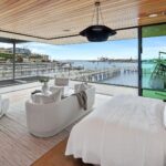 Mary Fitzgerald Instagram - Just Listed - 2201 Bayside Dr. - $27,995,000 5 Beds / 9 Baths / 9,129 Sq. Ft. / 11,921 Lot Size This newly constructed custom estate offers exclusive Corona Del Mar waterfront living with intricate design touches and a harmonious blend of natural stone and wood elements. Consisting of 5 ensuite bedrooms and 9 bathrooms and boasting approximately 50 feet of private beachfront, it caters to water enthusiasts and offers shared ownership of one of the longest private docks on the west coast, capable of accommodating multiple yachts up to 100ft in length. Upon arrival, you will be greeted by meticulously landscaped surroundings, a striking grand pivot door, and a double height foyer that sets the tone for the residence. Inside, the space boasts European wide plank bleached oak flooring by Gaetano, illuminated floating staircases, and expansive glass features that fill the approximately 9,129 square feet of interiors with an abundance of natural light. The property seamlessly connects to its surroundings through slide-away pocket doors that open onto a heated patio, a zero-edge saltwater pool and spa, and a courtyard featuring a built-in Lynx Grill. The kitchen features custom Honed Calcatta Vagli slab countertops and backsplash, a 55" La Canche designer stove imported from Paris, a butler's pantry, and stained white oak cabinetry. Convenience is paramount, with a Waupaca elevator servicing all four floors, including the lower level, which encompasses a media area, a dry bar, and temperature controlled wine room. Upstairs, the owner's suite presents a heated wraparound balcony with mesmerizing water views, a living space with a fireplace, and two spa-like bathrooms, each complemented by its own walk-in closet. The top level reveals a lounge area that opens onto a rooftop deck with grass and sweeping views of the Newport Beach Harbor offering limitless ocean-view entertaining. Equipped with cutting-edge technology, the property also includes a nearly 3,000 sq. ft., 6+ car garage with epoxy flooring. Listed by @briancharlesfurstenfeld @mskaylacardona @jasonoppenheim #theoppenheimgroup #realestate #luxurylifestyle #fyp #newlisting