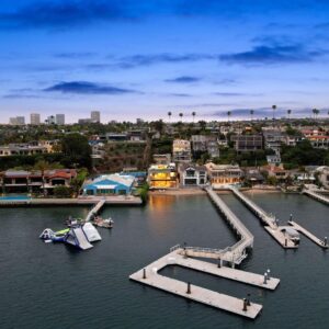 Mary Fitzgerald Instagram - Just Listed - 2201 Bayside Dr. - $27,995,000

5 Beds / 9 Baths / 9,129 Sq. Ft. / 11,921 Lot Size

This newly constructed custom estate offers exclusive Corona Del Mar waterfront living with intricate design touches and a harmonious blend of natural stone and wood elements. Consisting of 5 ensuite bedrooms and 9 bathrooms and boasting approximately 50 feet of private beachfront, it caters to water enthusiasts and offers shared ownership of one of the longest private docks on the west coast, capable of accommodating multiple yachts up to 100ft in length. Upon arrival, you will be greeted by meticulously landscaped surroundings, a striking grand pivot door, and a double height foyer that sets the tone for the residence. Inside, the space boasts European wide plank bleached oak flooring by Gaetano, illuminated floating staircases, and expansive glass features that fill the approximately 9,129 square feet of interiors with an abundance of natural light. The property seamlessly connects to its surroundings through slide-away pocket doors that open onto a heated patio, a zero-edge saltwater pool and spa, and a courtyard featuring a built-in Lynx Grill. The kitchen features custom Honed Calcatta Vagli slab countertops and backsplash, a 55" La Canche designer stove imported from Paris, a butler's pantry, and stained white oak cabinetry. Convenience is paramount, with a Waupaca elevator servicing all four floors, including the lower level, which encompasses a media area, a dry bar, and temperature controlled wine room. Upstairs, the owner's suite presents a heated wraparound balcony with mesmerizing water views, a living space with a fireplace, and two spa-like bathrooms, each complemented by its own walk-in closet. The top level reveals a lounge area that opens onto a rooftop deck with grass and sweeping views of the Newport Beach Harbor offering limitless ocean-view entertaining. Equipped with cutting-edge technology, the property also includes a nearly 3,000 sq. ft., 6+ car garage with epoxy flooring.

Listed by @briancharlesfurstenfeld @mskaylacardona @jasonoppenheim 

#theoppenheimgroup #realestate #luxurylifestyle #fyp #newlisting