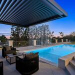 Mary Fitzgerald Instagram - Just Listed In Villa Park - 18541 Valley Dr. - $5,495,000 8 Beds / 8 Baths / 10,329 Sq. Ft. / 39,335 Lot Size Located in Orange County's prestigious Villa Park and set behind private gates on an elevated lot, this newly remodeled contemporary estate offers breathtaking views of the city and Catalina Island. Boasting 8 bedrooms, 8 baths, and over 10,000 sq. ft. of living space on an expansive nearly 40,000 sq. ft. lot, the home comes replete with every amenity necessary for luxe living and top-class entertainment. Enter into a light-filled foyer with double-height ceilings and a wrap-around staircase accentuated by a chandelier. The main level enjoys an open floor plan with flowing spaces accentuated by White Oak flooring. The cozy living area is framed by a wooden feature wall and marble fireplace. Adjacent to this, the dining area is replete with its own wooden accent feature wall, custom-built buffet cabinets, and designer chandelier. The chef's kitchen features a full set of Thermador appliances, custom White Oak cabinetry, leathered granite backsplash and countertops, and a large cascading center island with seating. A spacious breakfast nook with additional storage and views completes the kitchen area, with its own semi-private room with a fireplace perfect for an additional family/TV room. This entire level enjoys access to the sweeping yard with a resort-style pool and spa with smart controls, a Cantilever pergola with a rainfall feature, and a built-in BBQ, all enjoying more gorgeous views. The split-level primary suite enjoys high ceilings, a sitting area, fireplace, private balcony with sprawling unobstructed views, his-and-her closets, and a breathtaking spa-like bathroom with dual vanity, touchless heated smart toilet, large walk-in steam shower, freestanding bathtub, and sauna. Additional amenities include a secondary owner's suite with a large bathroom, a 1,000 sq. ft. theater with 11.2 Dolby Atmos system, two office spaces, a gym with massage room (could be wine or cigar room), a 4-car garage, and a 20-car motor court. Listing Agents: @alexanderhuerta_ @jasonoppenheim