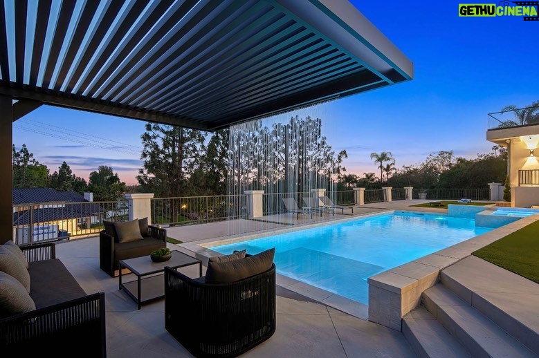 Mary Fitzgerald Instagram - Just Listed In Villa Park - 18541 Valley Dr. - $5,495,000 8 Beds / 8 Baths / 10,329 Sq. Ft. / 39,335 Lot Size Located in Orange County's prestigious Villa Park and set behind private gates on an elevated lot, this newly remodeled contemporary estate offers breathtaking views of the city and Catalina Island. Boasting 8 bedrooms, 8 baths, and over 10,000 sq. ft. of living space on an expansive nearly 40,000 sq. ft. lot, the home comes replete with every amenity necessary for luxe living and top-class entertainment. Enter into a light-filled foyer with double-height ceilings and a wrap-around staircase accentuated by a chandelier. The main level enjoys an open floor plan with flowing spaces accentuated by White Oak flooring. The cozy living area is framed by a wooden feature wall and marble fireplace. Adjacent to this, the dining area is replete with its own wooden accent feature wall, custom-built buffet cabinets, and designer chandelier. The chef's kitchen features a full set of Thermador appliances, custom White Oak cabinetry, leathered granite backsplash and countertops, and a large cascading center island with seating. A spacious breakfast nook with additional storage and views completes the kitchen area, with its own semi-private room with a fireplace perfect for an additional family/TV room. This entire level enjoys access to the sweeping yard with a resort-style pool and spa with smart controls, a Cantilever pergola with a rainfall feature, and a built-in BBQ, all enjoying more gorgeous views. The split-level primary suite enjoys high ceilings, a sitting area, fireplace, private balcony with sprawling unobstructed views, his-and-her closets, and a breathtaking spa-like bathroom with dual vanity, touchless heated smart toilet, large walk-in steam shower, freestanding bathtub, and sauna. Additional amenities include a secondary owner's suite with a large bathroom, a 1,000 sq. ft. theater with 11.2 Dolby Atmos system, two office spaces, a gym with massage room (could be wine or cigar room), a 4-car garage, and a 20-car motor court. Listing Agents: @alexanderhuerta_ @jasonoppenheim
