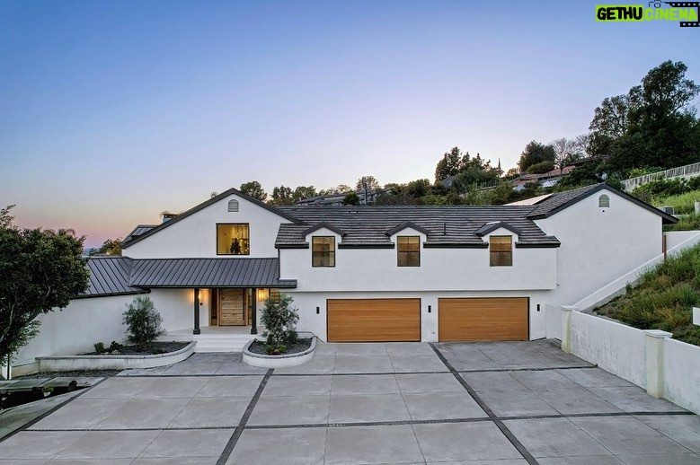 Mary Fitzgerald Instagram - Just Listed In Villa Park - 18541 Valley Dr. - $5,495,000 8 Beds / 8 Baths / 10,329 Sq. Ft. / 39,335 Lot Size Located in Orange County's prestigious Villa Park and set behind private gates on an elevated lot, this newly remodeled contemporary estate offers breathtaking views of the city and Catalina Island. Boasting 8 bedrooms, 8 baths, and over 10,000 sq. ft. of living space on an expansive nearly 40,000 sq. ft. lot, the home comes replete with every amenity necessary for luxe living and top-class entertainment. Enter into a light-filled foyer with double-height ceilings and a wrap-around staircase accentuated by a chandelier. The main level enjoys an open floor plan with flowing spaces accentuated by White Oak flooring. The cozy living area is framed by a wooden feature wall and marble fireplace. Adjacent to this, the dining area is replete with its own wooden accent feature wall, custom-built buffet cabinets, and designer chandelier. The chef's kitchen features a full set of Thermador appliances, custom White Oak cabinetry, leathered granite backsplash and countertops, and a large cascading center island with seating. A spacious breakfast nook with additional storage and views completes the kitchen area, with its own semi-private room with a fireplace perfect for an additional family/TV room. This entire level enjoys access to the sweeping yard with a resort-style pool and spa with smart controls, a Cantilever pergola with a rainfall feature, and a built-in BBQ, all enjoying more gorgeous views. The split-level primary suite enjoys high ceilings, a sitting area, fireplace, private balcony with sprawling unobstructed views, his-and-her closets, and a breathtaking spa-like bathroom with dual vanity, touchless heated smart toilet, large walk-in steam shower, freestanding bathtub, and sauna. Additional amenities include a secondary owner's suite with a large bathroom, a 1,000 sq. ft. theater with 11.2 Dolby Atmos system, two office spaces, a gym with massage room (could be wine or cigar room), a 4-car garage, and a 20-car motor court. Listing Agents: @alexanderhuerta_ @jasonoppenheim