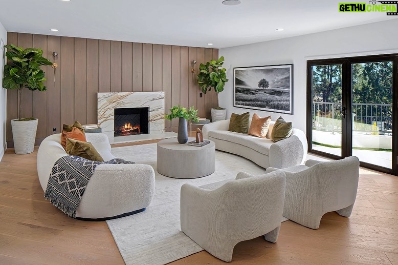 Mary Fitzgerald Instagram - Just Listed In Villa Park - 18541 Valley Dr. - $5,495,000 8 Beds / 8 Baths / 10,329 Sq. Ft. / 39,335 Lot Size Located in Orange County's prestigious Villa Park and set behind private gates on an elevated lot, this newly remodeled contemporary estate offers breathtaking views of the city and Catalina Island. Boasting 8 bedrooms, 8 baths, and over 10,000 sq. ft. of living space on an expansive nearly 40,000 sq. ft. lot, the home comes replete with every amenity necessary for luxe living and top-class entertainment. Enter into a light-filled foyer with double-height ceilings and a wrap-around staircase accentuated by a chandelier. The main level enjoys an open floor plan with flowing spaces accentuated by White Oak flooring. The cozy living area is framed by a wooden feature wall and marble fireplace. Adjacent to this, the dining area is replete with its own wooden accent feature wall, custom-built buffet cabinets, and designer chandelier. The chef's kitchen features a full set of Thermador appliances, custom White Oak cabinetry, leathered granite backsplash and countertops, and a large cascading center island with seating. A spacious breakfast nook with additional storage and views completes the kitchen area, with its own semi-private room with a fireplace perfect for an additional family/TV room. This entire level enjoys access to the sweeping yard with a resort-style pool and spa with smart controls, a Cantilever pergola with a rainfall feature, and a built-in BBQ, all enjoying more gorgeous views. The split-level primary suite enjoys high ceilings, a sitting area, fireplace, private balcony with sprawling unobstructed views, his-and-her closets, and a breathtaking spa-like bathroom with dual vanity, touchless heated smart toilet, large walk-in steam shower, freestanding bathtub, and sauna. Additional amenities include a secondary owner's suite with a large bathroom, a 1,000 sq. ft. theater with 11.2 Dolby Atmos system, two office spaces, a gym with massage room (could be wine or cigar room), a 4-car garage, and a 20-car motor court. Listing Agents: @alexanderhuerta_ @jasonoppenheim