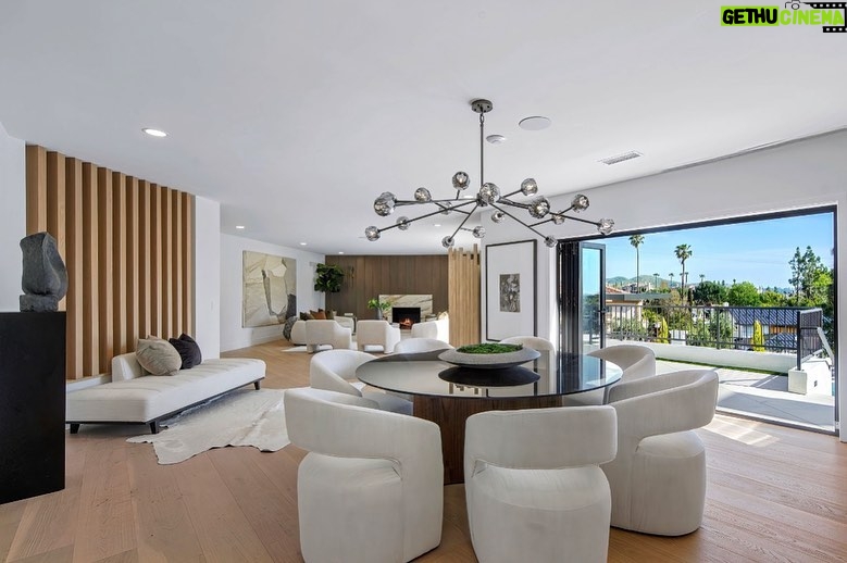 Mary Fitzgerald Instagram - Just Listed In Villa Park - 18541 Valley Dr. - $5,495,000 8 Beds / 8 Baths / 10,329 Sq. Ft. / 39,335 Lot Size Located in Orange County's prestigious Villa Park and set behind private gates on an elevated lot, this newly remodeled contemporary estate offers breathtaking views of the city and Catalina Island. Boasting 8 bedrooms, 8 baths, and over 10,000 sq. ft. of living space on an expansive nearly 40,000 sq. ft. lot, the home comes replete with every amenity necessary for luxe living and top-class entertainment. Enter into a light-filled foyer with double-height ceilings and a wrap-around staircase accentuated by a chandelier. The main level enjoys an open floor plan with flowing spaces accentuated by White Oak flooring. The cozy living area is framed by a wooden feature wall and marble fireplace. Adjacent to this, the dining area is replete with its own wooden accent feature wall, custom-built buffet cabinets, and designer chandelier. The chef's kitchen features a full set of Thermador appliances, custom White Oak cabinetry, leathered granite backsplash and countertops, and a large cascading center island with seating. A spacious breakfast nook with additional storage and views completes the kitchen area, with its own semi-private room with a fireplace perfect for an additional family/TV room. This entire level enjoys access to the sweeping yard with a resort-style pool and spa with smart controls, a Cantilever pergola with a rainfall feature, and a built-in BBQ, all enjoying more gorgeous views. The split-level primary suite enjoys high ceilings, a sitting area, fireplace, private balcony with sprawling unobstructed views, his-and-her closets, and a breathtaking spa-like bathroom with dual vanity, touchless heated smart toilet, large walk-in steam shower, freestanding bathtub, and sauna. Additional amenities include a secondary owner's suite with a large bathroom, a 1,000 sq. ft. theater with 11.2 Dolby Atmos system, two office spaces, a gym with massage room (could be wine or cigar room), a 4-car garage, and a 20-car motor court. Listing Agents: @alexanderhuerta_ @jasonoppenheim