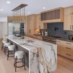 Mary Fitzgerald Instagram - Just Listed In Villa Park - 18541 Valley Dr. - $5,495,000 8 Beds / 8 Baths / 10,329 Sq. Ft. / 39,335 Lot Size Located in Orange County's prestigious Villa Park and set behind private gates on an elevated lot, this newly remodeled contemporary estate offers breathtaking views of the city and Catalina Island. Boasting 8 bedrooms, 8 baths, and over 10,000 sq. ft. of living space on an expansive nearly 40,000 sq. ft. lot, the home comes replete with every amenity necessary for luxe living and top-class entertainment. Enter into a light-filled foyer with double-height ceilings and a wrap-around staircase accentuated by a chandelier. The main level enjoys an open floor plan with flowing spaces accentuated by White Oak flooring. The cozy living area is framed by a wooden feature wall and marble fireplace. Adjacent to this, the dining area is replete with its own wooden accent feature wall, custom-built buffet cabinets, and designer chandelier. The chef's kitchen features a full set of Thermador appliances, custom White Oak cabinetry, leathered granite backsplash and countertops, and a large cascading center island with seating. A spacious breakfast nook with additional storage and views completes the kitchen area, with its own semi-private room with a fireplace perfect for an additional family/TV room. This entire level enjoys access to the sweeping yard with a resort-style pool and spa with smart controls, a Cantilever pergola with a rainfall feature, and a built-in BBQ, all enjoying more gorgeous views. The split-level primary suite enjoys high ceilings, a sitting area, fireplace, private balcony with sprawling unobstructed views, his-and-her closets, and a breathtaking spa-like bathroom with dual vanity, touchless heated smart toilet, large walk-in steam shower, freestanding bathtub, and sauna. Additional amenities include a secondary owner's suite with a large bathroom, a 1,000 sq. ft. theater with 11.2 Dolby Atmos system, two office spaces, a gym with massage room (could be wine or cigar room), a 4-car garage, and a 20-car motor court. Listing Agents: @alexanderhuerta_ @jasonoppenheim