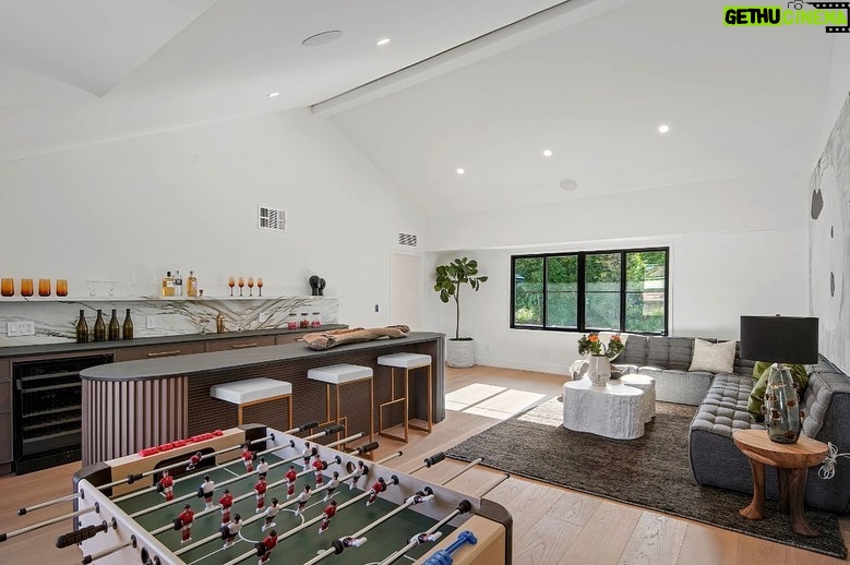 Mary Fitzgerald Instagram - Just Listed In Villa Park - 18541 Valley Dr. - $5,495,000 8 Beds / 8 Baths / 10,329 Sq. Ft. / 39,335 Lot Size Located in Orange County's prestigious Villa Park and set behind private gates on an elevated lot, this newly remodeled contemporary estate offers breathtaking views of the city and Catalina Island. Boasting 8 bedrooms, 8 baths, and over 10,000 sq. ft. of living space on an expansive nearly 40,000 sq. ft. lot, the home comes replete with every amenity necessary for luxe living and top-class entertainment. Enter into a light-filled foyer with double-height ceilings and a wrap-around staircase accentuated by a chandelier. The main level enjoys an open floor plan with flowing spaces accentuated by White Oak flooring. The cozy living area is framed by a wooden feature wall and marble fireplace. Adjacent to this, the dining area is replete with its own wooden accent feature wall, custom-built buffet cabinets, and designer chandelier. The chef's kitchen features a full set of Thermador appliances, custom White Oak cabinetry, leathered granite backsplash and countertops, and a large cascading center island with seating. A spacious breakfast nook with additional storage and views completes the kitchen area, with its own semi-private room with a fireplace perfect for an additional family/TV room. This entire level enjoys access to the sweeping yard with a resort-style pool and spa with smart controls, a Cantilever pergola with a rainfall feature, and a built-in BBQ, all enjoying more gorgeous views. The split-level primary suite enjoys high ceilings, a sitting area, fireplace, private balcony with sprawling unobstructed views, his-and-her closets, and a breathtaking spa-like bathroom with dual vanity, touchless heated smart toilet, large walk-in steam shower, freestanding bathtub, and sauna. Additional amenities include a secondary owner's suite with a large bathroom, a 1,000 sq. ft. theater with 11.2 Dolby Atmos system, two office spaces, a gym with massage room (could be wine or cigar room), a 4-car garage, and a 20-car motor court. Listing Agents: @alexanderhuerta_ @jasonoppenheim