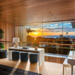 Mary Fitzgerald Instagram - Just Listed in Manhattan Beach - 1001 1st St. - $29,900,000 6 Bed / 9 Bath / 9,479 Sq. Ft. The most impressive and high-quality Contemporary estate ever built in Manhattan Beach, featuring panoramic ocean views from every room. After a laborious multi-year build, this approximately 9,500 sq. ft. showstopper seamlessly fuses glass, cedar, and concrete into a triumphant architectural tour de force with a sense of permanence and grandeur. Integral to the structure and aesthetic of the home, the scalloped concrete walls seen on the exterior and interior walls resemble an undulating wave-like texture accomplished by custom milled formwork which complement the surrounding Pacific landscape. Custom cedar clads the remaining walls and ceilings, bringing warmth and visual impact throughout the sleek space. Double-height ceilings and oversized automated Otiima pocketing doors and windows create a sense of expansion within, as the home seamlessly unfolds into an extensive beautifully landscaped outdoor terrace and pool/spa perfect for California living. An additional shaded patio with fireplace is created by the deep cedar overhangs from the upper floor and the roof. Generously nestled on an extra-wide corner lot, the home is replete with 6 bedrooms plus an additional office/nursery, 9 bathrooms, home theater, game room, wine cellar, wet bar, and gym, with architecture by Laney LA. Additional amenities include 48 solar panels with Tesla Powerwalls, elevator, 14 zone A/C technology platform system, Control4 home automation, and 3-car garage with additional driveway parking. An exceptionally rare opportunity to own a meticulously crafted beach estate with soul and sophistication.