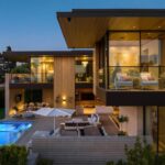 Mary Fitzgerald Instagram - Just Listed in Manhattan Beach - 1001 1st St. - $29,900,000 6 Bed / 9 Bath / 9,479 Sq. Ft. The most impressive and high-quality Contemporary estate ever built in Manhattan Beach, featuring panoramic ocean views from every room. After a laborious multi-year build, this approximately 9,500 sq. ft. showstopper seamlessly fuses glass, cedar, and concrete into a triumphant architectural tour de force with a sense of permanence and grandeur. Integral to the structure and aesthetic of the home, the scalloped concrete walls seen on the exterior and interior walls resemble an undulating wave-like texture accomplished by custom milled formwork which complement the surrounding Pacific landscape. Custom cedar clads the remaining walls and ceilings, bringing warmth and visual impact throughout the sleek space. Double-height ceilings and oversized automated Otiima pocketing doors and windows create a sense of expansion within, as the home seamlessly unfolds into an extensive beautifully landscaped outdoor terrace and pool/spa perfect for California living. An additional shaded patio with fireplace is created by the deep cedar overhangs from the upper floor and the roof. Generously nestled on an extra-wide corner lot, the home is replete with 6 bedrooms plus an additional office/nursery, 9 bathrooms, home theater, game room, wine cellar, wet bar, and gym, with architecture by Laney LA. Additional amenities include 48 solar panels with Tesla Powerwalls, elevator, 14 zone A/C technology platform system, Control4 home automation, and 3-car garage with additional driveway parking. An exceptionally rare opportunity to own a meticulously crafted beach estate with soul and sophistication.