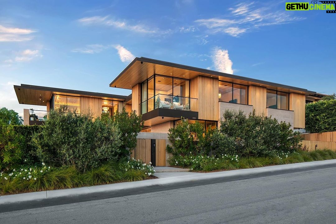 Mary Fitzgerald Instagram - Just Listed in Manhattan Beach - 1001 1st St. - $29,900,000 6 Bed / 9 Bath / 9,479 Sq. Ft. The most impressive and high-quality Contemporary estate ever built in Manhattan Beach, featuring panoramic ocean views from every room. After a laborious multi-year build, this approximately 9,500 sq. ft. showstopper seamlessly fuses glass, cedar, and concrete into a triumphant architectural tour de force with a sense of permanence and grandeur. Integral to the structure and aesthetic of the home, the scalloped concrete walls seen on the exterior and interior walls resemble an undulating wave-like texture accomplished by custom milled formwork which complement the surrounding Pacific landscape. Custom cedar clads the remaining walls and ceilings, bringing warmth and visual impact throughout the sleek space. Double-height ceilings and oversized automated Otiima pocketing doors and windows create a sense of expansion within, as the home seamlessly unfolds into an extensive beautifully landscaped outdoor terrace and pool/spa perfect for California living. An additional shaded patio with fireplace is created by the deep cedar overhangs from the upper floor and the roof. Generously nestled on an extra-wide corner lot, the home is replete with 6 bedrooms plus an additional office/nursery, 9 bathrooms, home theater, game room, wine cellar, wet bar, and gym, with architecture by Laney LA. Additional amenities include 48 solar panels with Tesla Powerwalls, elevator, 14 zone A/C technology platform system, Control4 home automation, and 3-car garage with additional driveway parking. An exceptionally rare opportunity to own a meticulously crafted beach estate with soul and sophistication.