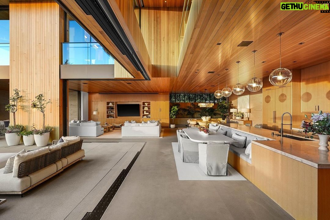 Mary Fitzgerald Instagram - Just Listed in Manhattan Beach - 1001 1st St. - $29,900,000 6 Bed / 9 Bath / 9,479 Sq. Ft. The most impressive and high-quality Contemporary estate ever built in Manhattan Beach, featuring panoramic ocean views from every room. After a laborious multi-year build, this approximately 9,500 sq. ft. showstopper seamlessly fuses glass, cedar, and concrete into a triumphant architectural tour de force with a sense of permanence and grandeur. Integral to the structure and aesthetic of the home, the scalloped concrete walls seen on the exterior and interior walls resemble an undulating wave-like texture accomplished by custom milled formwork which complement the surrounding Pacific landscape. Custom cedar clads the remaining walls and ceilings, bringing warmth and visual impact throughout the sleek space. Double-height ceilings and oversized automated Otiima pocketing doors and windows create a sense of expansion within, as the home seamlessly unfolds into an extensive beautifully landscaped outdoor terrace and pool/spa perfect for California living. An additional shaded patio with fireplace is created by the deep cedar overhangs from the upper floor and the roof. Generously nestled on an extra-wide corner lot, the home is replete with 6 bedrooms plus an additional office/nursery, 9 bathrooms, home theater, game room, wine cellar, wet bar, and gym, with architecture by Laney LA. Additional amenities include 48 solar panels with Tesla Powerwalls, elevator, 14 zone A/C technology platform system, Control4 home automation, and 3-car garage with additional driveway parking. An exceptionally rare opportunity to own a meticulously crafted beach estate with soul and sophistication.