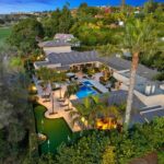 Mary Fitzgerald Instagram - Just Listed in Carlsbad - 7229 Almaden Ln. - $5,995,000 6 Beds / 7 Baths / 6,226 Sq. Ft. / 24,829 Lot Size As you enter this grand estate beyond a long, private driveway, you are enveloped in unparalleled luxury within the residence, gracefully situated along the 14th fairway of the La Costa Golf Course, recently revitalized by acclaimed golf-course architect Gil Hanse. After crossing a bridge above a beautiful koi pond leading to a grand doorway, a tranquil ambiance envelops you, marked by a magnificent water wall that establishes Feng Shui harmony. This residence, which boasts panoramic views of the esteemed golf course, seamlessly integrates indoor and outdoor living, with each room effortlessly connecting to the expansive yard. The gourmet kitchen is a culinary sanctuary equipped with state-of-the-art Gaggenau appliances. Enjoy dynamic gatherings in the Teppanyaki room, featuring a professional cooktop and custom copper hood that transforms into a poker table and cigar lounge. A smart home system allows for effortless control of lighting, sound, and a nine-foot drop-down theater screen in the living room. Additional features include an outdoor humidor, wine bar, wood-fired pizza oven, and a fully lit outdoor bar with heated countertops. Entertainment reaches new heights with a private putting green and a newly tiled pool/spa accompanied by a water wall featuring a fire element. The outdoor area extends to a covered full catering Viking kitchen equipped with a large BBQ, smoker oven, refrigerator, dishwasher, and warming drawers. For golf enthusiasts, the property offers private automatic gates for golf cart access directly onto the green, providing a rare and exclusive experience. Ample parking for 10+ cars on a long driveway and additional three car garage. Listed By: Jason Oppenheim - DRE#: 01983697 Diana Harton - DRE#: 02021702 Mary Bonnet - DRE#: 01800489 Matthew Peters - DRE#: 01901784