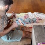 Mat Fraser Instagram - Morning routine. Learning to play the ukulele while in Hawaii seems fitting and Eddy loves it. This is the phase of life where I’ll do anything for those smiles. #girldad #ukulele