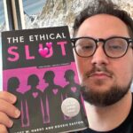 Matt McGorry Instagram – “The Ethical Sl🫦t” by Janet W. Hardy & Dossie Easton 

Where my polyamorous/non-monogamous ethical sl🔥ts at?? 🤗🥹🤗🥹

I’ve been polyamorous for a few years now and have read quite a few books about it. But this was the first book that I read that really started me on the path. The funny thing is, I had it on my bookshelf for years as I identified as monogamous but for some reason I never read it. Perhaps I subconsciously knew that it would start to open some doors for me that would change my life, and that there would be no going back from. And that somehow, I just didn’t feel ready. 

There is nothing wrong with monogamy itself. The same way there is nothing wrong with heterosexuality. But the problem is where the compulsory aspects of it lie. For example, I do believe that a lot more people would explore and step outside of monogamy (and heterosexuality for that matter) if it were not so heavily stigmatized to do so. While the social norms are shifting, there is still much work to be done transforming the systems and cultural beliefs that shame, pressure and coerce people into thinking that monogamy is the only real viable choice.

It’s only been a couple of years since I realized that polyamory was for me and it took me most of that time to feel comfortable fully embracing it in a way where I would be okay with people knowing that about me, as a public figure.

For me, reading is an essential piece of how I learn about new things that I’m passionate about. And because we don’t often see examples of how to have conversations about these issues, it can feel really challenging to know where to start. I believe that is the magic of books. For those who don’t feel comfortable just jumping into shit 🙋🏻‍♂️, it gives us the opportunity to get some clarity about our desires and to build the capacity, skills, and tools that allow us to express those needs. 

May we all work towards the courage of giving space for and identifying our deepest desires and being able to put them into words. 

My Booklist:
bit.ly/mcgreads (link in bio)
#McGReads