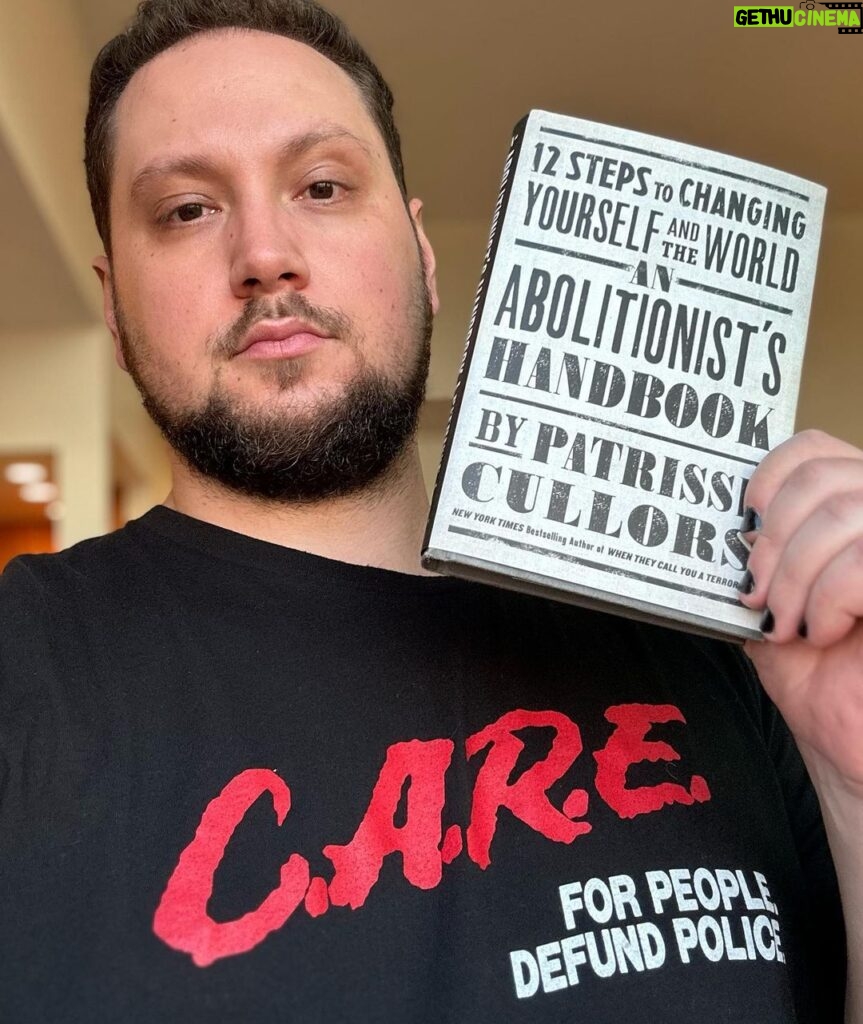 Matt McGorry Instagram - "An Abolitionist's Handbook: 12 Steps to Changing Yourself and The World" by Patrisse Cullors ( @osopepatrisse ) Shirt from @foreveryone.collective Abolition is about divesting from policing and prisons, but it is equally about what we are investing in. What would our communities look like if we invested in people, healing, and connection instead of punishment and state-sanctioned revenge? I believe that abolition is not just a practice that we invest in with our political campaigns but with our daily actions and values. It's a spiritual practice that evolves as we evolve. It's a creative practice that involves engaging with the world in ways that we likely have never been taught how to do. I am thinking about #KeenanAnderson , the cousin of Patrisse (who wrote this book) who was murdered by LAPD just weeks ago. The current system is egregious and it consumes untold resources. Let us build something different. My Booklist: bit.ly/mcgreads (link in bio) #McGReads
