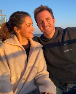 Matthew Hussey Instagram - This first picture was taken the night Audrey and I met! How crazy is it that we have a picture from the night we met! A friend of Audrey’s randomly took the photo of us, and then sent us the photo 2 years later when they found it on their phone and realized we had become serious! We’d literally met for the first time an hour before this picture was taken. Just two lil babies flirtin’.

I wasn’t even going to go to this party. I just happened to be back in London for Christmas that week and a friend of mine persuaded me to go. When we were on the way, that same friend told me: “There is a girl who will be there that all the boys are in love with, and we’re all afraid you’re going to steal her”. He didn’t tell me who it was when we walked in, but within minutes I knew. 

I was glued to the tv in the bar at the beginning of the evening because there was this big boxing match on that night, but I kept making eye contact with her the whole time. She sidled up next to me, started watching the tv, and then asked me a question about the boxing (something she has never shown an interest in since). And that was that. We talked for 8 hours that night (literally). 

David Brookes once said:

“A marriage is a 50 year conversation. Have I met a person who I can talk to for that length of time?” 

I have, which is why I asked this incredible human being to marry me. 

I can’t believe I get to build a life with someone as amazing as you. I’m stupidly excited to do it all with you—to be grown ups and do all the grown up things, while deep down staying just two lil babies flirtin’.

Happy Valentine’s Day @theaudreyhussey. I love you forever. ❤️