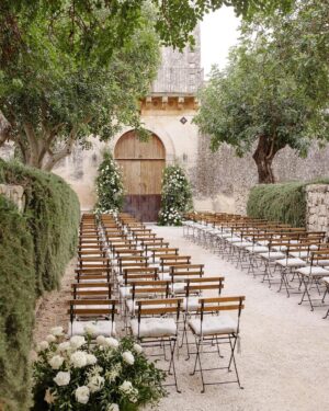 Matthew Hussey Instagram - I want to give a huge thank you to the people behind our wedding, @lyndenlane.

@lyndenlane are renowned event planners and interior designers, but I came across them because they planned my friend’s wedding. Live events are something I've had a passion for since starting my company, and my standards are HIGH! But this was one of the most beautiful events I’d ever seen. As a result, we had our hearts set on working with them and they completely blew us away . . . 

🕯️ When Audrey and I expressed we didn't want to spend a fortune on flowers, they went out and bought an insane number of candles and hung string lighting for a third of the price. The result was absolutely breathtaking (see pic).

🍴They brought their own silverware in an extra (and undoubtedly VERY heavy) piece of luggage they lugged all the way to Italy because they preferred it to the silverware the venue provided. 

🪡 When Audrey's dress broke right before the ceremony, they calmly sewed her back into it on the spot!

🪩 They anticipated Audrey's feet hurting during the party so had bought ahead of time a pair of comfy sneakers for her to change into late in the evening.

🤍 They learned all our family members' names and faces before the wedding day so they could make each and every one of them feel special when they got there.

This is to name but a few unbelievable details-(remember what I’ve said before about the trash cans? [IYKYK] Well, @lyndenlane show what this looks like in action). And this is just what they did on the weekend. They also spent a year executing our dream vision for our wedding, as well as helping us understand what that was. It was extraordinary. 

We learned so much from working with them that I'm now thinking of doing an entire podcast with them on how to plan an unforgettable event—whether it’s a wedding, a special birthday party, or any kind of seasonal event. What do you think? Leave me a comment! 

Oh, and if you're planning a once-in-a-lifetime event, DM them directly at @lyndenlane. I cannot recommend them highly enough. From the bottom of our hearts, thank you Lyndsey, Layne, Barbie & your incredible team. We love you guys ♥️ 

Stunning 📸’s by @sarahfalugo.co