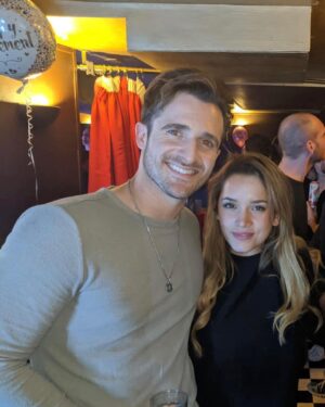 Matthew Hussey Instagram - This first picture was taken the night Audrey and I met! How crazy is it that we have a picture from the night we met! A friend of Audrey’s randomly took the photo of us, and then sent us the photo 2 years later when they found it on their phone and realized we had become serious! We’d literally met for the first time an hour before this picture was taken. Just two lil babies flirtin’.

I wasn’t even going to go to this party. I just happened to be back in London for Christmas that week and a friend of mine persuaded me to go. When we were on the way, that same friend told me: “There is a girl who will be there that all the boys are in love with, and we’re all afraid you’re going to steal her”. He didn’t tell me who it was when we walked in, but within minutes I knew. 

I was glued to the tv in the bar at the beginning of the evening because there was this big boxing match on that night, but I kept making eye contact with her the whole time. She sidled up next to me, started watching the tv, and then asked me a question about the boxing (something she has never shown an interest in since). And that was that. We talked for 8 hours that night (literally). 

David Brookes once said:

“A marriage is a 50 year conversation. Have I met a person who I can talk to for that length of time?” 

I have, which is why I asked this incredible human being to marry me. 

I can’t believe I get to build a life with someone as amazing as you. I’m stupidly excited to do it all with you—to be grown ups and do all the grown up things, while deep down staying just two lil babies flirtin’.

Happy Valentine’s Day @theaudreyhussey. I love you forever. ❤️