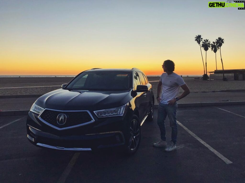 Matthew Lewis Instagram - At the third stroke, the time sponsored by @acura will be: DRIVETIME! Niche British gags aside, I’m thrilled to have partnered with @acura and to be driving their new MDX. Crazy tech on this vehicle and plenty of room for the dogs. It makes me appreciate life so much that I drive out to watch the sunset and look wistfully over my shoulder. I was caught doing just that here in this completely candid and not at all posed photograph. #AcuraPartner
