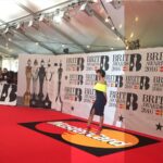 Maya Jama Instagram - She’s hosting The Brit Awards💫 Realised I don’t post as much work stuff on here as I should but I wrote down a list of goals as a presenter as soon as I left my retail job and this was the final one I had to tick off🥹 To say 16year old me wouldn’t believe it would be a lie, every single goal I wrote down I knew was possible I just had no idea when or how, self belief & prayer is so crucial, if you believe it you can achieve it as cliche as that is, looking back at it all got me emosh, there’s beauty in the journey.. & here we are 🙏🏽 Pic 2 is the first time I ever attended at 21 and I hadn’t learnt how to pose on red carpets so my fist was clenched behind my back from nerves 😂 Pic 3 is the first time I hosted the red carpet show in 2018 Video is me doing interviews for the Critics choice performances in 2016 Hosted the pre show a few years in a row, last minute stint on the main show & nowww il see you on March 2nd with the guyssss 👋❤️