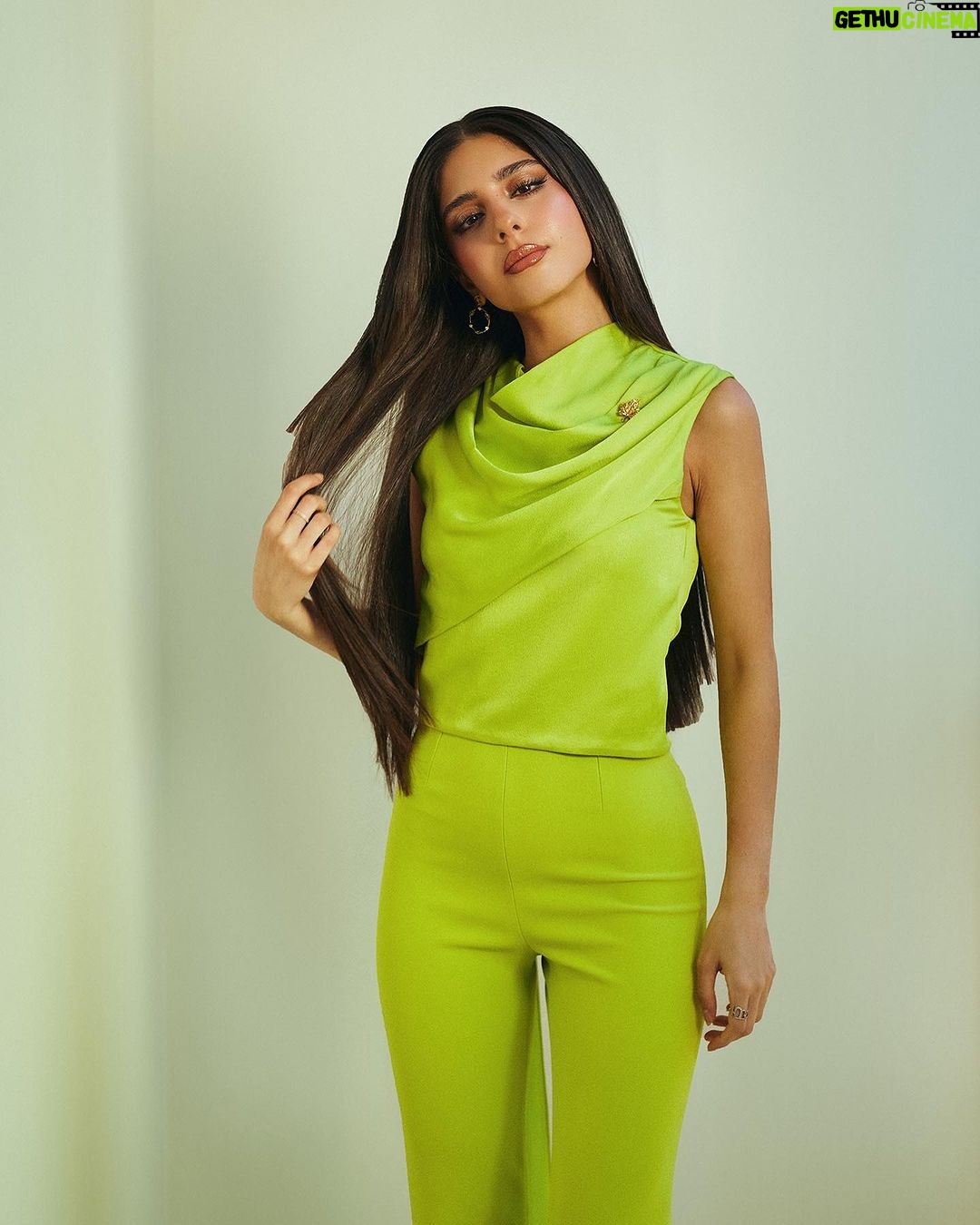 Mayan ElSayed Instagram - Green for @garnierarabia 💚 Big thanks to the amazing team behind this look✨ Photographer: @mahmoudaphotography Stylist: @yasminekenawi Assistant Stylist: @faridahammouda MUA: @rehamkhalifaa Hair: @saeedashraf00_ @alamode.salon Jumpsuit: @safiyaa_official Earrings: @treshermanasjewellery Brooch: @vintagelanejewelry