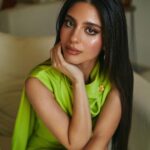 Mayan ElSayed Instagram - Green for @garnierarabia 💚 Big thanks to the amazing team behind this look✨ Photographer: @mahmoudaphotography Stylist: @yasminekenawi Assistant Stylist: @faridahammouda MUA: @rehamkhalifaa Hair: @saeedashraf00_ @alamode.salon Jumpsuit: @safiyaa_official Earrings: @treshermanasjewellery Brooch: @vintagelanejewelry