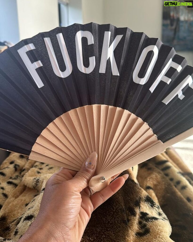 Mel B Instagram - When your friend knows your vibe so well, they gift you the ultimate ‘express yourself’ accessory. 🖤🤘 Thanks to the fabulous @joancollinsdbe for this bold statement piece - because sometimes a ‘fuck off’ fan speaks louder than words! 😂✨ #GiftGoals #JoanCollinsApproved