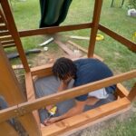 Melvin Gregg Instagram - A Quick lil Sandbox Build! There was a lot of unusable space under Marley’s Playset so I decided it would be better as a sandbox. I was able to repurpose the extra beams from Bobbie’s garden for the walls & I disassembled the bench to make a shelf for his sand toys.