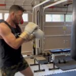Michael Bisping Instagram - Morning workout in the bag. 20 minutes on the Climbr 10 rounds of bag work followed by circuits.