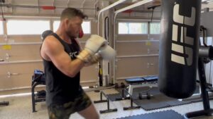 Michael Bisping Instagram - Morning workout in the bag. 20 minutes on the Climbr 10 rounds of bag work followed by circuits.