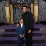 Michael Ealy Instagram - It's been our job as your parents to show you the world and all its possibilities. On this night, it was an honor to see you shine on your own! I thought i was just bringing you to the premiere of your first and favorite superhero. One that I didn't have nor could even dream of when I was your age. I thought that would be enough. My man! To be able to hold your hand throughout this experience was an honor son. In this very moment with my dear friend the incomparable @nischelleturner you, the little man that you're becoming, reached for me and said the most amazing words to her about me and my world stopped! ❤️ You never know what your kids think of you because at your age, you're kind of cagey about your feelings. So for you to open up the way you did meant so much to me. But what really affected me was the way you reached for me with so much pride. I'm so grateful that whoever took this shot caught this magical moment! THANK YOU! We have given you everything we have and we can't always tell what seeps in. However, on this night you revealed so much to me and mom with the most loving gesture and a few simple words that let me know where... where I stand with you. We love you. I love you. Keep shining young King. Boba got u. #BlackPanther #WakandaForever PS... RUN don't walk to go see this movie!