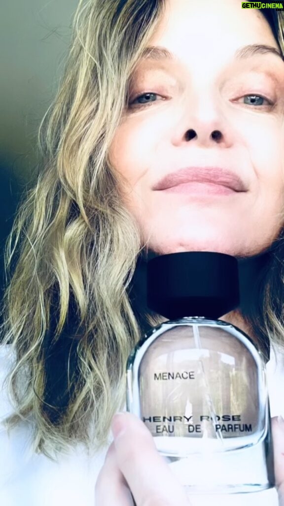 Michelle Pfeiffer Instagram - Sometimes I just feel like trouble. #Menace Deep marine notes crash against invigorating lime heart, anchored by musk and Mediterranean cypress. Introducing Menace by @henryrose 🖤