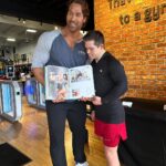 Mike O'Hearn Instagram - What an awesome week in California thanks to @goldsgymvenice1 for your hospitality I cannot describe the feeling looking through @schwarzenegger album with @mikeohearn Two gentlemen I’ve had the privilege of learning from. #greenrangerkyle #bodybuilding #bodybuilder #downsyndrome #downsyndromebodybuilder #emdstigma #fitness #motivation #fyp #fypシ #foryoupage #explorepage Golds Gym Venice Beach