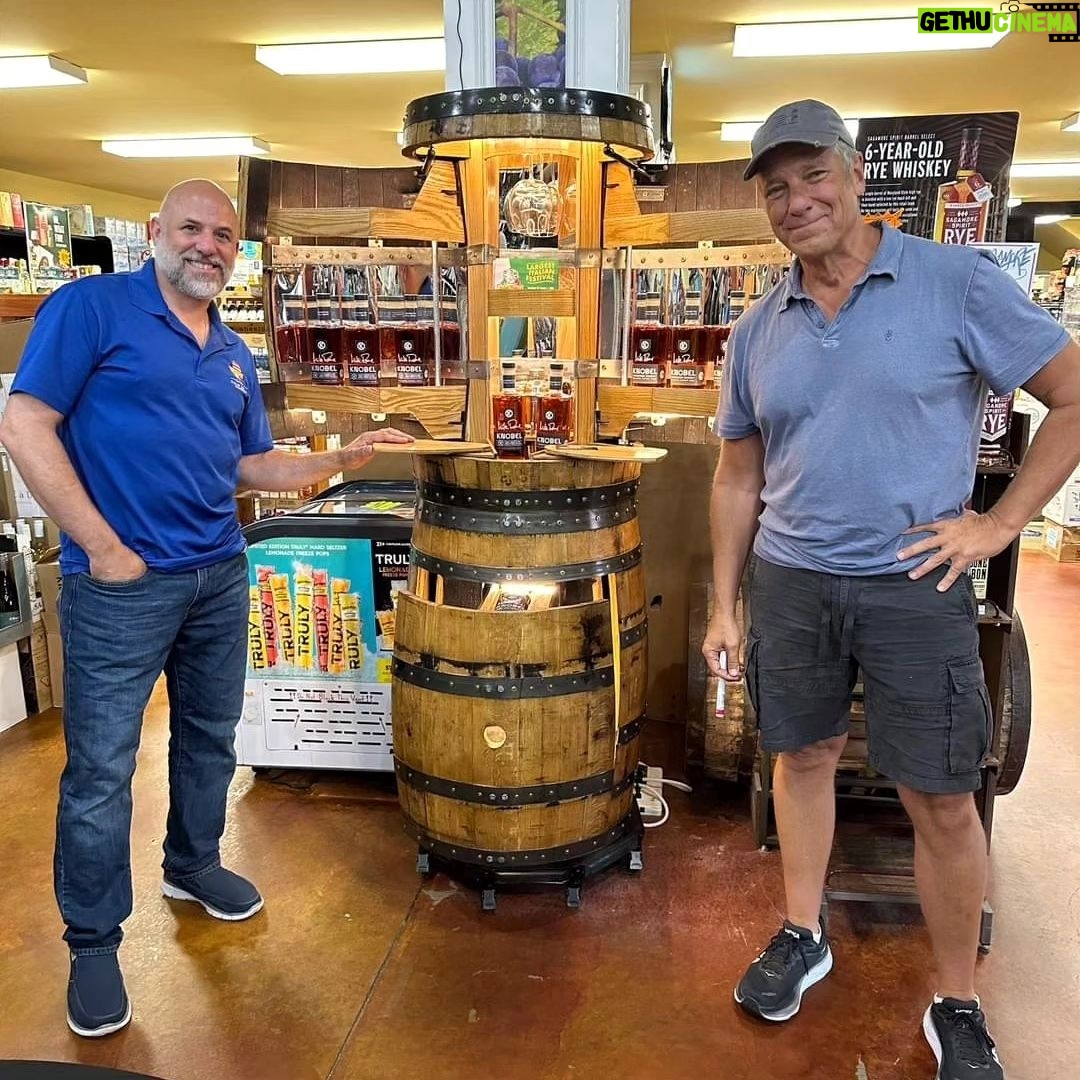 Mike Rowe Instagram - Sunday, outside of @BelAirLiquors there was thunder and lightning and an inch of rain falling every 30 minutes. Inside, there were over 100 well-mannered people with excellent taste in whiskey, waiting patiently in line to shake my hand and grab a photo. What do you say to people who brave a hurricane to say hello and buy a signed bottle of your grandfather’s whiskey? Well, if you’re me, you say “thanks,” as sincerely as you can, over and over again. Among others was the Pelletier family, all 14 of them. This is the largest family I’ve ever posed for a photo with, and I’m not even sure they were all represented. Once you show up with 14, you have to assume there’s another 3 or 4 in the wings, right? I don’t remember each of their names, but I think it was young Jake (?) who made a crab out of stones, mounted it in a very tasteful frame, and presented it to me as a gift. Thanks, Jake. Very thoughtful. I’ll hang it in a place of prominence upon my return. I met Nick Berte, who built a very cool Double Whiskey Barrel Liquor Cabinet, that opens and closes with the touch of a remote control. The store is raffling it off at the annual Maryland Italian Festival to raise money for charity. I met Mike Griffith, who is a Maryland State Delegate for District 35B. I know this because he gave me his business card, which I I’ll hang on to. You never know when you need the services of a state delegate, right? And then there was Jon, a Baltimore County Detective who was shot four times by a creep with an AR-15 just a few months ago. Jon survived, happily, and was released from the hospital not long ago. His wounds are very serious, but he stood in line like all the others, thanked me for supporting first responders, and gave me a patch that said, “Don’t Die Easy.” What do you say to a guy who risks his life to serve and protect you, gets damn near killed, and then comes out on a rainy Sunday to shake your hand? If you’re me, you say “thanks,” as sincerely as you can, over and over again. I proprietor, Larry Dean, and his hardworking family. Big thanks to all of you guys, for making it happen. And congratulations for having such awesome customers. Till next time. Belair Md