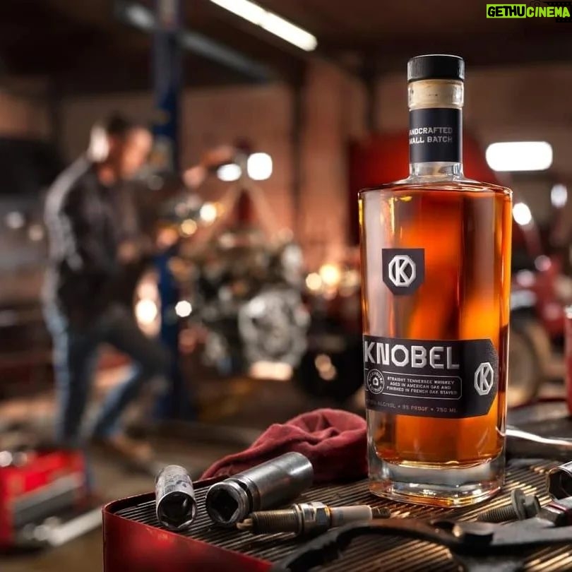 Mike Rowe Instagram - I’ve been delighted, flattered, (and relieved), by the response to Knobel Tennessee Whiskey. My Pop would be proud, and it’s been fun to watch it grow over the last year. These photos were taken by Don Ventre in a factory and a garage in Cincinnati. Funny story… The photos taken in the factory were a total accident. Don was there to photograph a new machine in action, but a critical part didn’t arrive as scheduled. Rather than just sit around all morning, Don grabbed a bottle of Knobel (which he apparently travels with) and set up a few quick shots that will probably win some kind of award. The grinder in the background is pretty great. The stuff in the garage was a bit more deliberate. Every detail, every tool, every shadow and shaft of light was carefully and meticulously designed and styled. I’m not invited to shoots like this, because I lack the patience required for this level of detail and nuance. On Dirty Jobs, we don’t even do second takes but here you can see how a single bottle of whiskey requires the undivided attention of three professional photographers, a stylist, a digitech, and a mechanic who doubled as a hand-model. I also love the fact that this is the garage Don uses in real life, and this is his actual mechanic, Keith Brogan. Big thanks to him, along with Laura Klasamer, Mark Corelli, and Don Ventre for treating photography like the skilled trade it is. Since we now live in a time where the words, “This Bag is NOT a Toy” appear on bags all over the country, I suppose I should say that @KnobelWhiskey should NOT be consumed while operating heavy machinery in a factory, or in a garage while fixing someone’s vehicle. Nor is it intended to be opened with a wrench, as certain idiots might assume the photo implies. As long as I’m pointing out the obvious, I should also tell you that you can still get a bottle for yourself. It really does taste as good as it looks and every online purchase benefits the @mikeroweWORKS Foundation. Finally, and apropos of nothing, the season finale of #DirtyJobs airs tonight at 8PM on @Discovery. I don’t want to say too much, but beavers will be squeezed...More on that, later. Link in bio