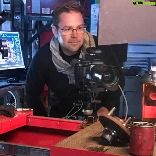 Mike Rowe Instagram - I’ve been delighted, flattered, (and relieved), by the response to Knobel Tennessee Whiskey. My Pop would be proud, and it’s been fun to watch it grow over the last year. These photos were taken by Don Ventre in a factory and a garage in Cincinnati. Funny story… The photos taken in the factory were a total accident. Don was there to photograph a new machine in action, but a critical part didn’t arrive as scheduled. Rather than just sit around all morning, Don grabbed a bottle of Knobel (which he apparently travels with) and set up a few quick shots that will probably win some kind of award. The grinder in the background is pretty great. The stuff in the garage was a bit more deliberate. Every detail, every tool, every shadow and shaft of light was carefully and meticulously designed and styled. I’m not invited to shoots like this, because I lack the patience required for this level of detail and nuance. On Dirty Jobs, we don’t even do second takes but here you can see how a single bottle of whiskey requires the undivided attention of three professional photographers, a stylist, a digitech, and a mechanic who doubled as a hand-model. I also love the fact that this is the garage Don uses in real life, and this is his actual mechanic, Keith Brogan. Big thanks to him, along with Laura Klasamer, Mark Corelli, and Don Ventre for treating photography like the skilled trade it is. Since we now live in a time where the words, “This Bag is NOT a Toy” appear on bags all over the country, I suppose I should say that @KnobelWhiskey should NOT be consumed while operating heavy machinery in a factory, or in a garage while fixing someone’s vehicle. Nor is it intended to be opened with a wrench, as certain idiots might assume the photo implies. As long as I’m pointing out the obvious, I should also tell you that you can still get a bottle for yourself. It really does taste as good as it looks and every online purchase benefits the @mikeroweWORKS Foundation. Finally, and apropos of nothing, the season finale of #DirtyJobs airs tonight at 8PM on @Discovery. I don’t want to say too much, but beavers will be squeezed...More on that, later. Link in bio