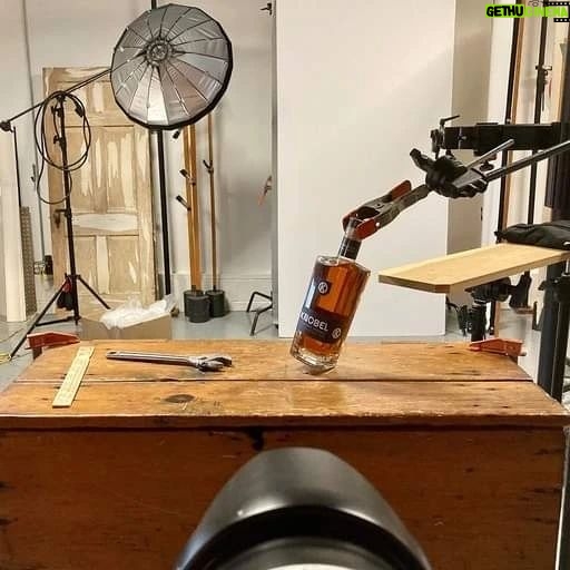 Mike Rowe Instagram - I’ve been delighted, flattered, (and relieved), by the response to Knobel Tennessee Whiskey. My Pop would be proud, and it’s been fun to watch it grow over the last year. These photos were taken by Don Ventre in a factory and a garage in Cincinnati. Funny story… The photos taken in the factory were a total accident. Don was there to photograph a new machine in action, but a critical part didn’t arrive as scheduled. Rather than just sit around all morning, Don grabbed a bottle of Knobel (which he apparently travels with) and set up a few quick shots that will probably win some kind of award. The grinder in the background is pretty great. The stuff in the garage was a bit more deliberate. Every detail, every tool, every shadow and shaft of light was carefully and meticulously designed and styled. I’m not invited to shoots like this, because I lack the patience required for this level of detail and nuance. On Dirty Jobs, we don’t even do second takes but here you can see how a single bottle of whiskey requires the undivided attention of three professional photographers, a stylist, a digitech, and a mechanic who doubled as a hand-model. I also love the fact that this is the garage Don uses in real life, and this is his actual mechanic, Keith Brogan. Big thanks to him, along with Laura Klasamer, Mark Corelli, and Don Ventre for treating photography like the skilled trade it is. Since we now live in a time where the words, “This Bag is NOT a Toy” appear on bags all over the country, I suppose I should say that @KnobelWhiskey should NOT be consumed while operating heavy machinery in a factory, or in a garage while fixing someone’s vehicle. Nor is it intended to be opened with a wrench, as certain idiots might assume the photo implies. As long as I’m pointing out the obvious, I should also tell you that you can still get a bottle for yourself. It really does taste as good as it looks and every online purchase benefits the @mikeroweWORKS Foundation. Finally, and apropos of nothing, the season finale of #DirtyJobs airs tonight at 8PM on @Discovery. I don’t want to say too much, but beavers will be squeezed...More on that, later. Link in bio