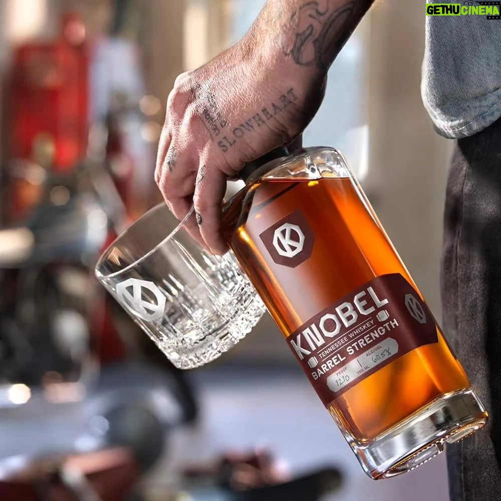 Mike Rowe Instagram - Hi Roy I bring you good tidings of great joy. Or at least, some pretty good news. After a long and protracted delay, we now have in our storeroom a modest supply of Knobel Barrel Strength Whiskey. It's awfully good, especially with a single cube, but be advised, it packs a punch. 121 proof, last I checked. Online proceeds benefit the @mikeroweworks Foundation, which, as you may have heard, is giving away a million dollars in our next round of scholarships. Applications will be accepted at the end of the month, at mikeroweWORKS. But you don't have to wait that long for a snort, at knobelspirits.com (link in bio.) Mike PS. The person attached to the hand in the photo is not me. While I have nothing against tattoos, I don't have any. But if I did, I'd be open to, or at least intrigued, by the notion of the word "SLOWHEART" festooned upon flesh beneath my left pinky. It seems like a good indicator of a healthy cardiovascular system, or maybe, a sign of prudence. Regardless, the hand in question is gripping some very good whiskey.