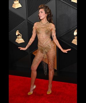 Miley Cyrus Instagram - This dress took 675 hours of artisanal hand crafted work, 14,000 golden safety pins & is adorned with singularly selected French antique beads. Thank you.
