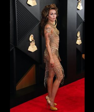 Miley Cyrus Instagram - This dress took 675 hours of artisanal hand crafted work, 14,000 golden safety pins & is adorned with singularly selected French antique beads. Thank you.