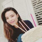 Miranda Cosgrove Instagram - Today was my Birthday. Here’s a picture of me with my half-cake that my Mom made from scratch that was supposed to be a full cake but half got stuck in the pan. I had 5 candles, my mom and dad, and my oldest friend with me. Hope all the other people with quarantine Birthdays have memorable ones too and thanks for all the birthday wishes!