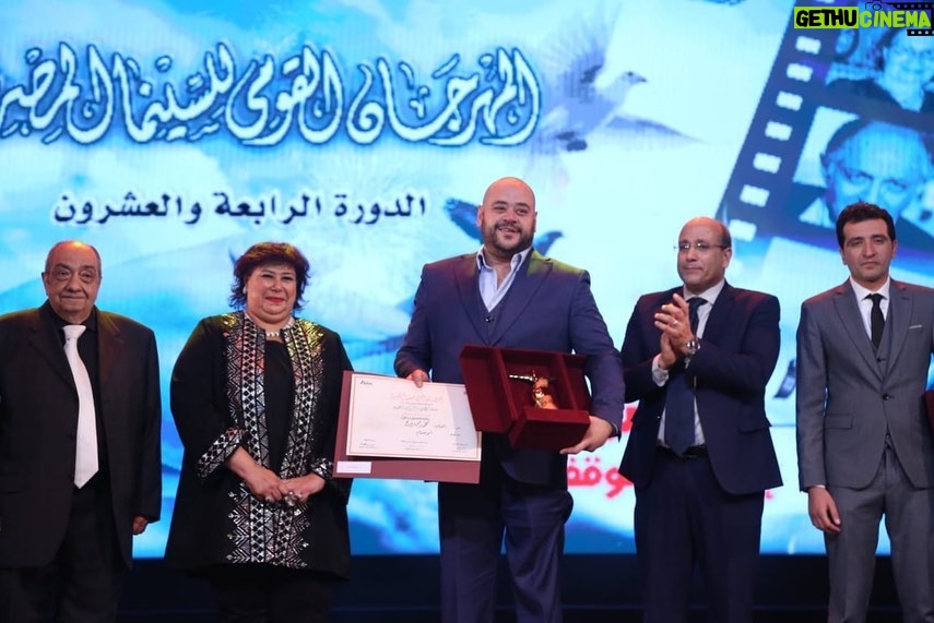 Mohamed Mamdouh Instagram - سعيد جدا بحصولي على جايزة المهرجان القومي للسينما المصري عن دوري في فيلم ابو صدام، مبروك احمد فهمي ونادين خان واحمد داش وزينة منصور واسرة فيلم ابو صدام بالكامل وبشكر طبعا الدكتورة ايناس عبد الدايم وزيرة الثقافة والمهرجان القومي للسينما المصري ولجنة التحكيم والقائمين على المهرجان. @seacinemaproductions