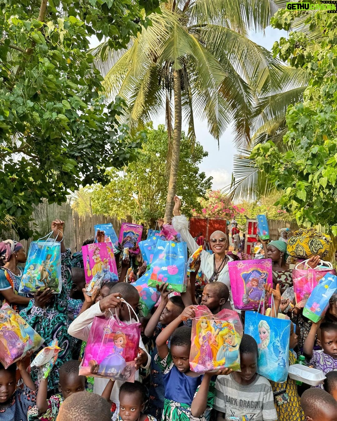 Nancy Isime Instagram - On my way to my New Year Holiday destination, as we drove through the beach front community to the resort in Ouidah, I saw a bunch of Happy Kids just running around, playing, waving and just being Kids. That picture lingered in my heart for a minute, I wanted to be a part of the Children’s Joy, to be a reason they have even bigger smiles and a wonderful New Year! So I asked my Lodge’s owner and manager if it was okay to have a mini party for the Kids and mothers of the community. I asked for a figure(number of kids &Mothers), booked the venue(the resort’s beachfront), arranged for some bags of rice, oil and a chef to cook some local delicacy for the kids, sent for gift items from Lagos and arranged to have it transported to me and Voila! Lunch with Nancy was brought to Reality! As hectic as it looks, I had such a great time! My heart bursting with Joy!😄🥰 Of all the Gifts of the Spirit, Love, Joy, Peace, Kindness and Goodness remain my Favorites and I do everything in my power to practice these everyday and everywhere I go. I’m thankful to God for causing my plans and Idea for this day to come to fruition even under such short notice and barely any planning. I’m thankful to the resort’s owner, Manager & Staff for doing everything in their power to see to its success. I’m very thankful to the mothers & kids of the Laguna, Ouidah community for letting me partake in their Joy and start their New Year with some goodies..Even with the language barrier and me being a complete stranger, my invitation was still honored and respected. Shoutout to my girl Adaora for agreeing under such short notice to bring the gift items over as well as help me out during our mini lunch party. Shoutout to my amazing team for co-ordinating/helping with the market runs for the gift items. God is the Kindest❤️ I hope this inspires you to look around and make a difference even while on Holiday☺️ Ouidah, Bénin